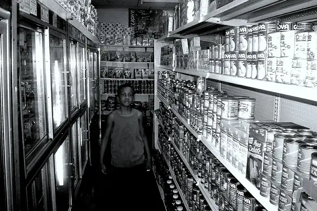 This lad is not accused of any wrongdoing, but he is in the beer aisle of a bodega.